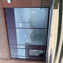 Double height glass and aluminium shop front with frosted glass uk