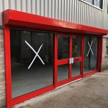 Red shop front design for industrial building uk